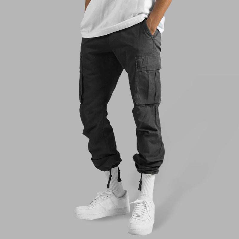 Men's solid color cargo pocket casual trousers with flap pockets, mid waist, and leisure style.