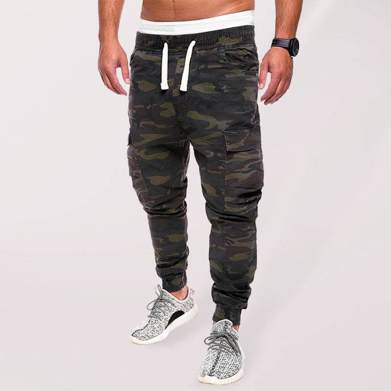 Men's camouflage cargo casual pants with drawstring waist, modeled outdoors.