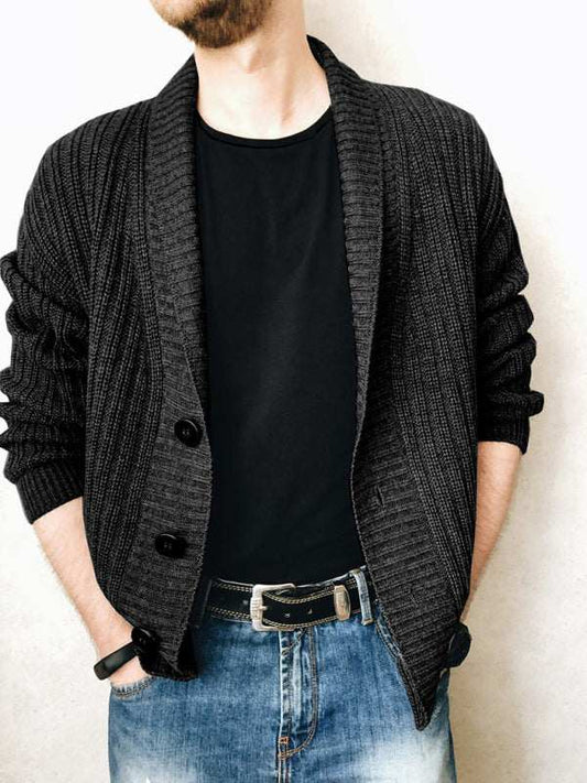 Men's casual ribbed open front cardigan in black, paired with jeans.