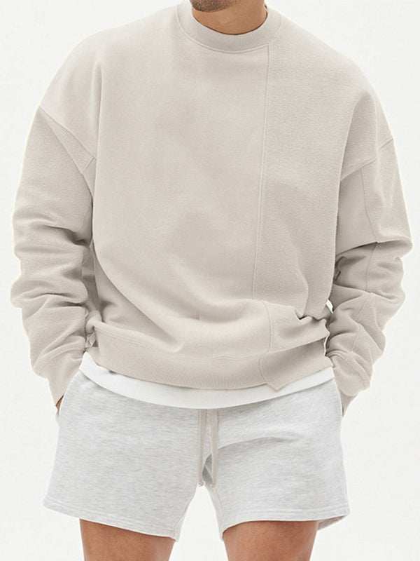 Men's knitted stitching solid color casual crew neck sweatshirt with dropped shoulder sleeves.