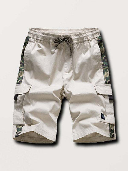 Men's camouflage print cargo shorts with multi-pocket design and panel details.