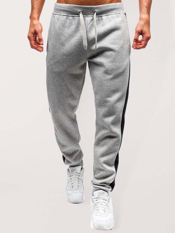 Men's fashion casual stitching pencil trousers in gray with drawstring waist.