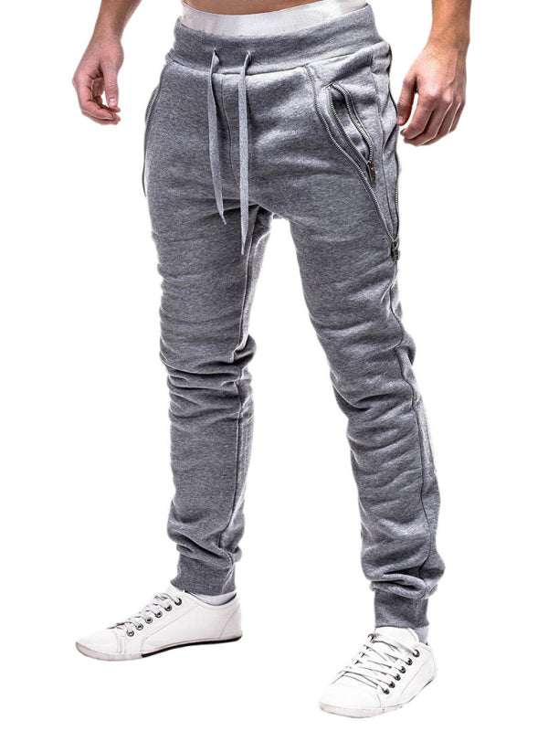 Men's grey casual zipper trim trousers with drawstring, mid-waist design.