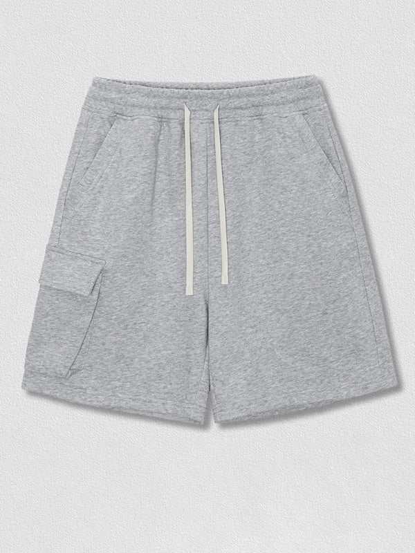 Men's grey woven casual shorts with contrasting color stitching and slant pockets.