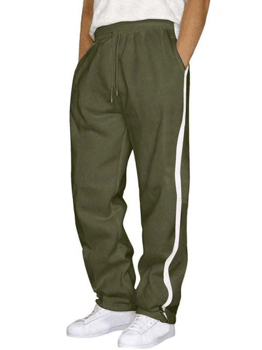 Men's winter loose fashionable trousers in green with side stripe, made of cotton and polyester.