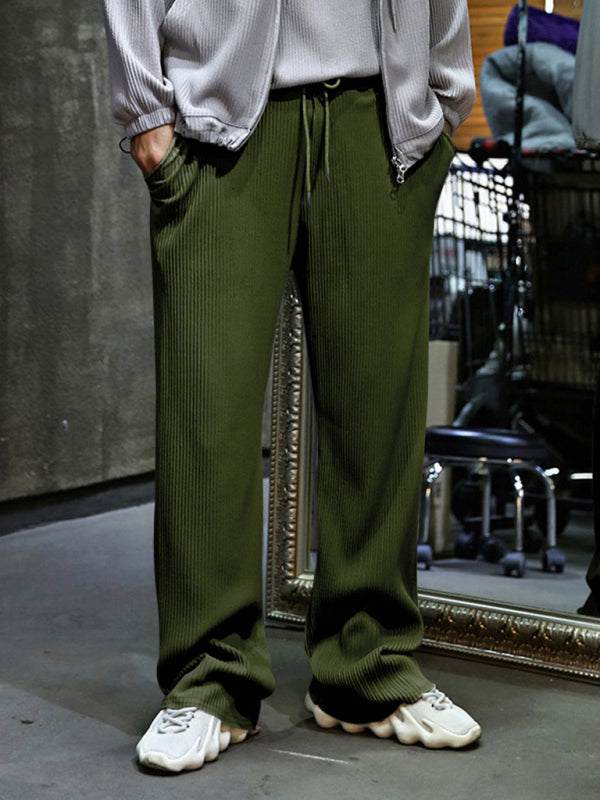 Men's loose straight casual trousers, green, with slant pockets and a drapey, wide-leg design.