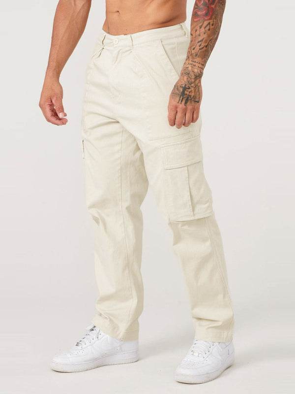 Men's spliced solid color casual sports loose overalls in beige with flap pockets, suitable for spring-summer.