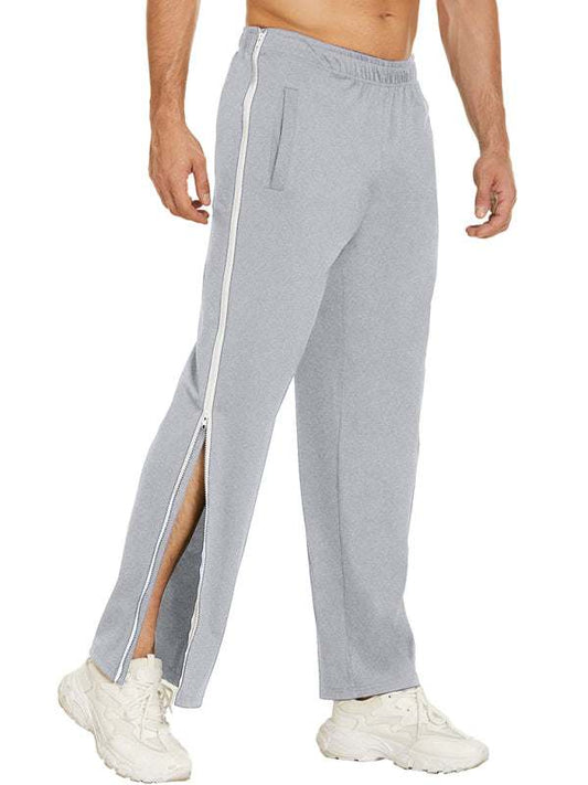 Men's solid color trendy sports sweatpants with side zipper and loose fit.