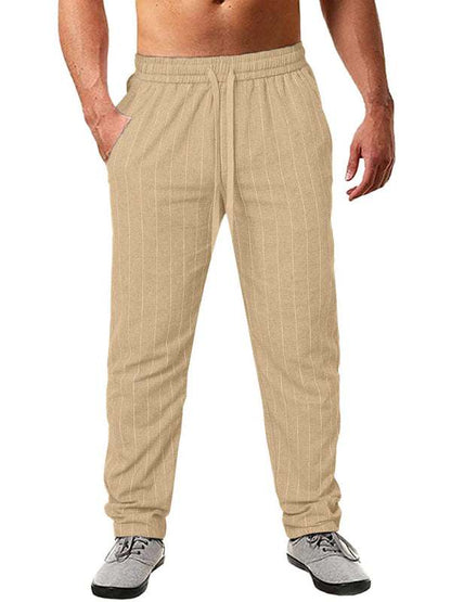 Men's vertical striped elastic waist beach pants in beige, casual trousers.