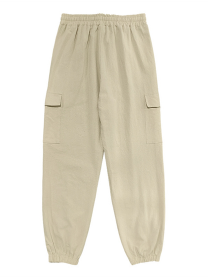 Relaxed Fit Solid Color Drawstring Trousers with Multi-Pocket Design and Casual Cuffs