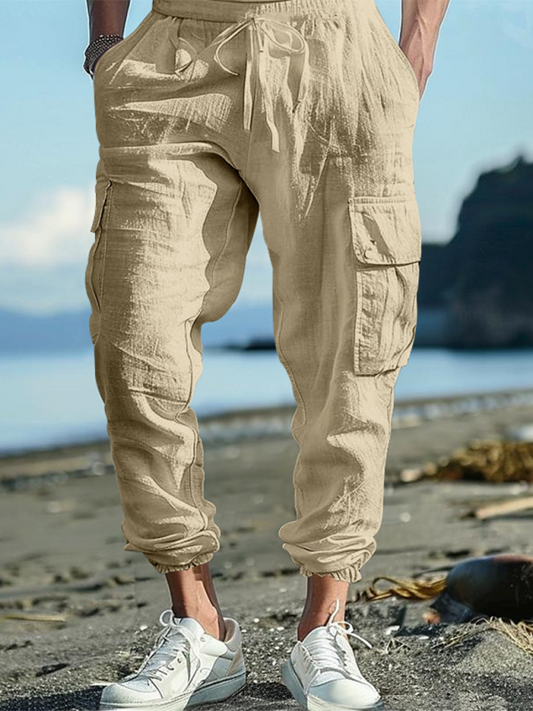 Casual loose drawstring trousers with multi-pocket design and cuffs, solid color, suitable for spring-summer.