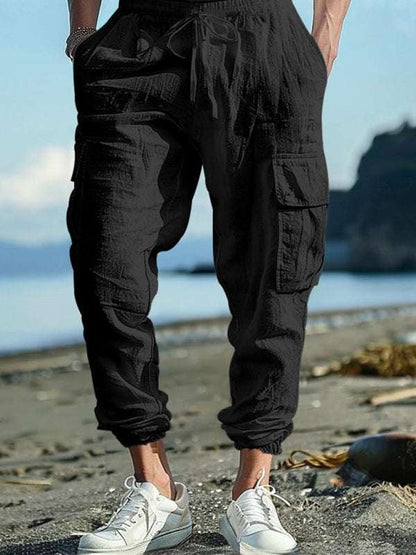 Relaxed Fit Solid Color Drawstring Trousers with Multi-Pocket Design and Casual Cuffs