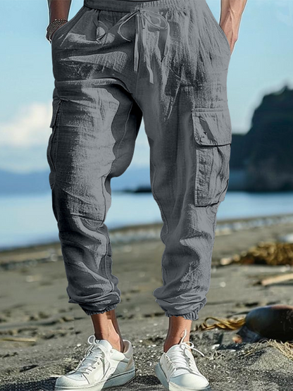 Relaxed Fit Solid Color Drawstring Trousers with Multi-Pocket Design and Casual Cuffs